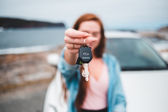 Girl holding her car keys.