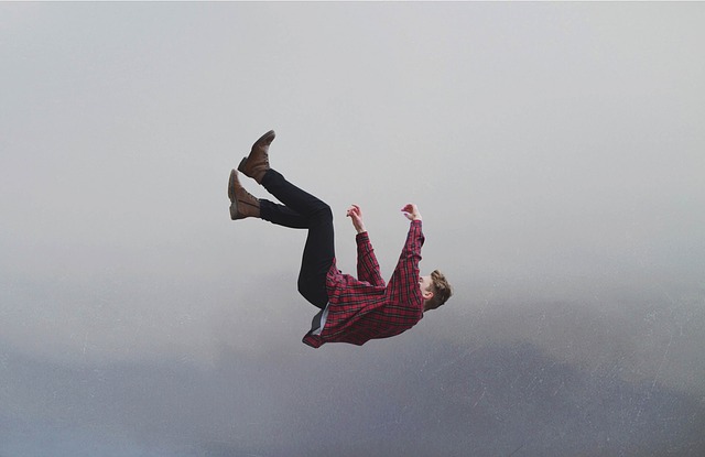 man suspended in the air, falling.