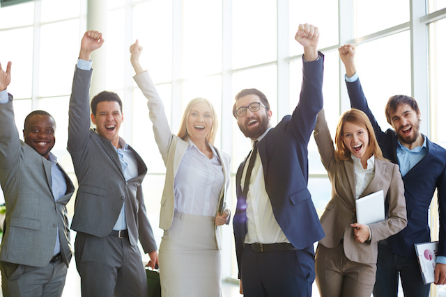 people at work celebrating their productive success.